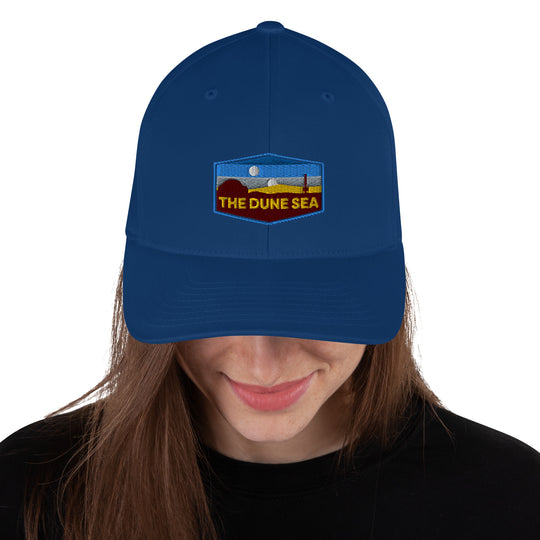 Woman wearing blue Dune sea Star Wars flexfit hat.